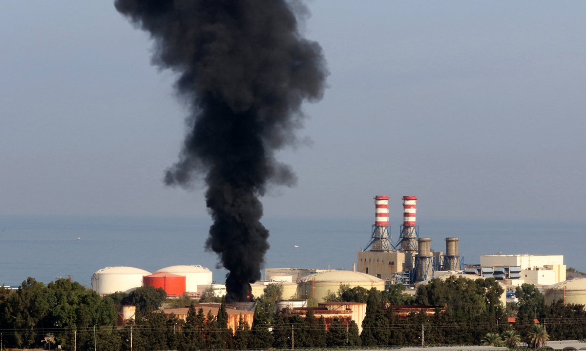 Smoke billows from a huge fire in one of the tanks at the Zahrani oil facility in southern Lebanon on Monday, sparking alarm as the country grapples with dire hydrocarbon shortages. Photo: AFP