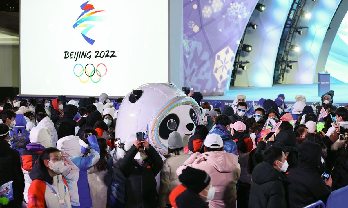 Bing Dwen Dwen, the popular mascot of the Beijing 2022 Winter Games, attends the awarding ceremony of women's 500m speed skating event along with spectators and volunteers at the awarding ceremony square on February 14, 2022. Photo: Xinhua