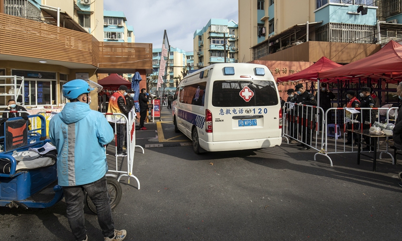 An ambulance enters a residential neighborhood placed under lockdown due to Covid-19 in Shanghai on March 10, 2022. Photo: VCG