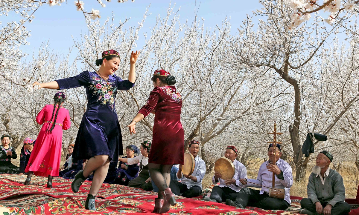People are holding a Meshrep, a traditional Uygur community gathering, in Hami city of Xinjiang. Photo: IC