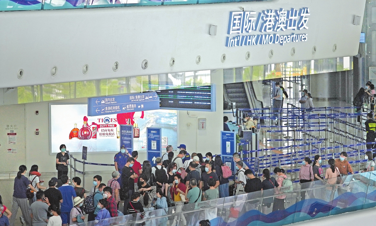 Students and travelers check in at the Shekou Cruise Home Port in Shenzhen, South China's Guangdong Province, and depart to Hong Kong International Airport by ferry on September 22, 2022. Photo: IC