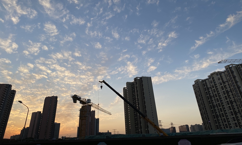 Cranes are seen at a construction site of a housing complex in Beijing. Photo: VCG