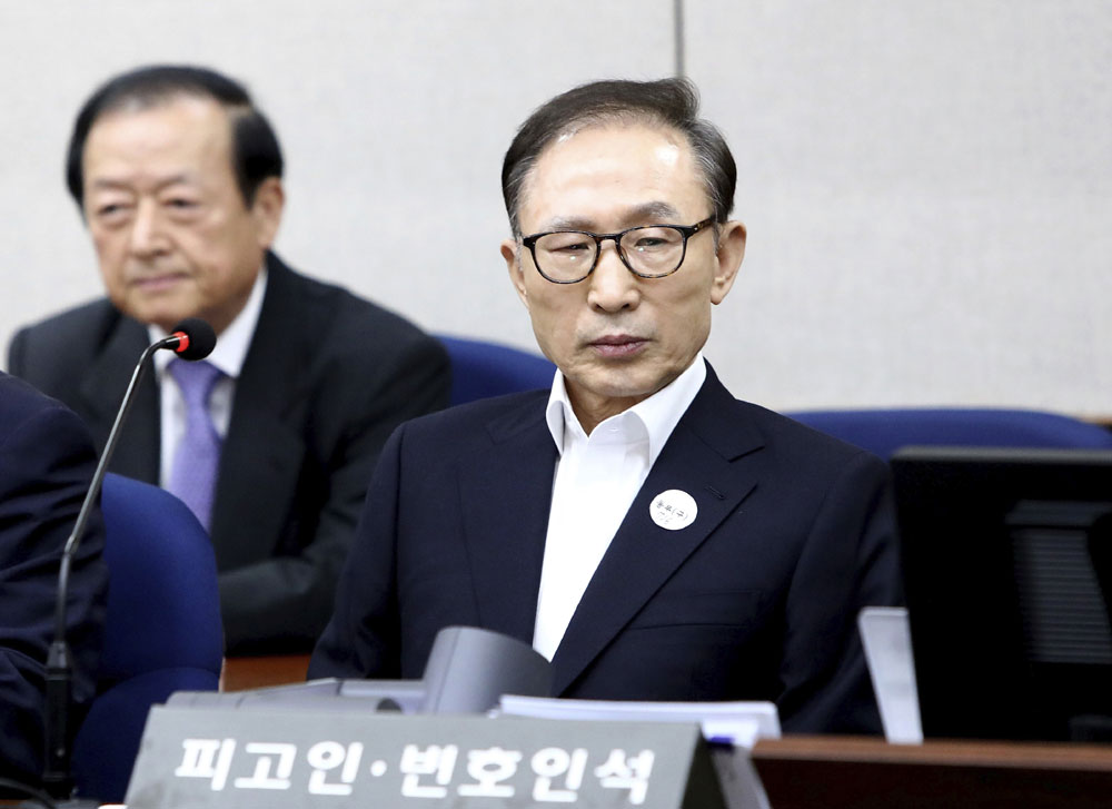Former South Korean President Lee Myung-bak appears for his first trial at the Seoul Central District Court in Seoul Wednesday, May 23, 2018. A South Korea court issued an arrest warrant for Lee on corruption charges on March 23, 2018. [Photo: Pool Photo via AP/Chung Sung-Jun]