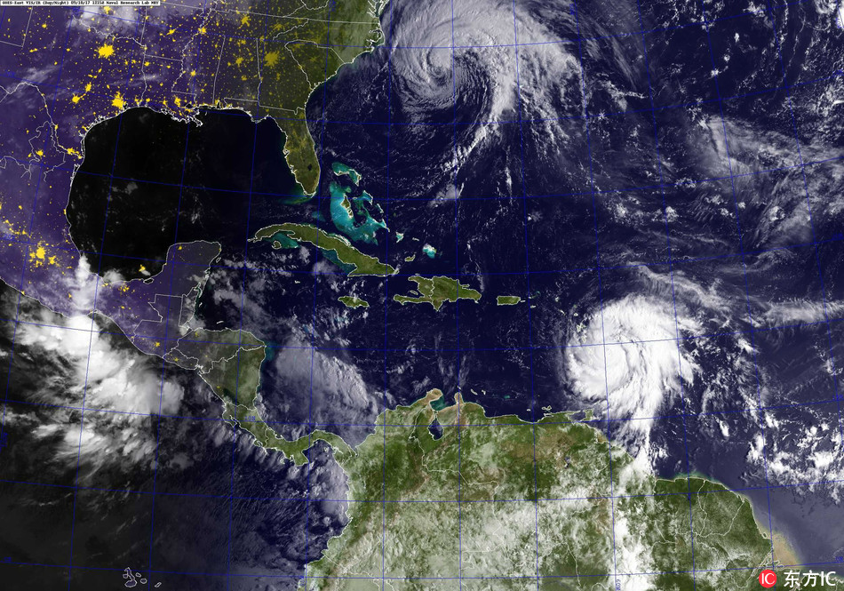 A handout made available by the US Navy shows a GOES satellite image of Hurricanes Jose (top) in the Atlantic Ocean and Maria in the Carribean Sea, 18 September 2017. [Photo: IC]
