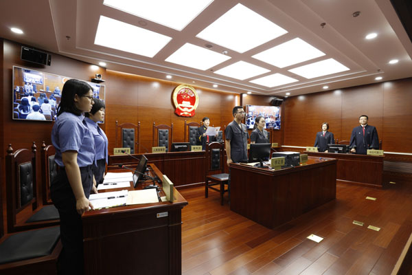 A trial on a case marking the first public-interest lawsuit concerning air quality initiated by prosecutors in Beijing takes place at a court in Beijing's No.4 Intermediate People's Court on June 5th, 2018. [Photo: China Plus]