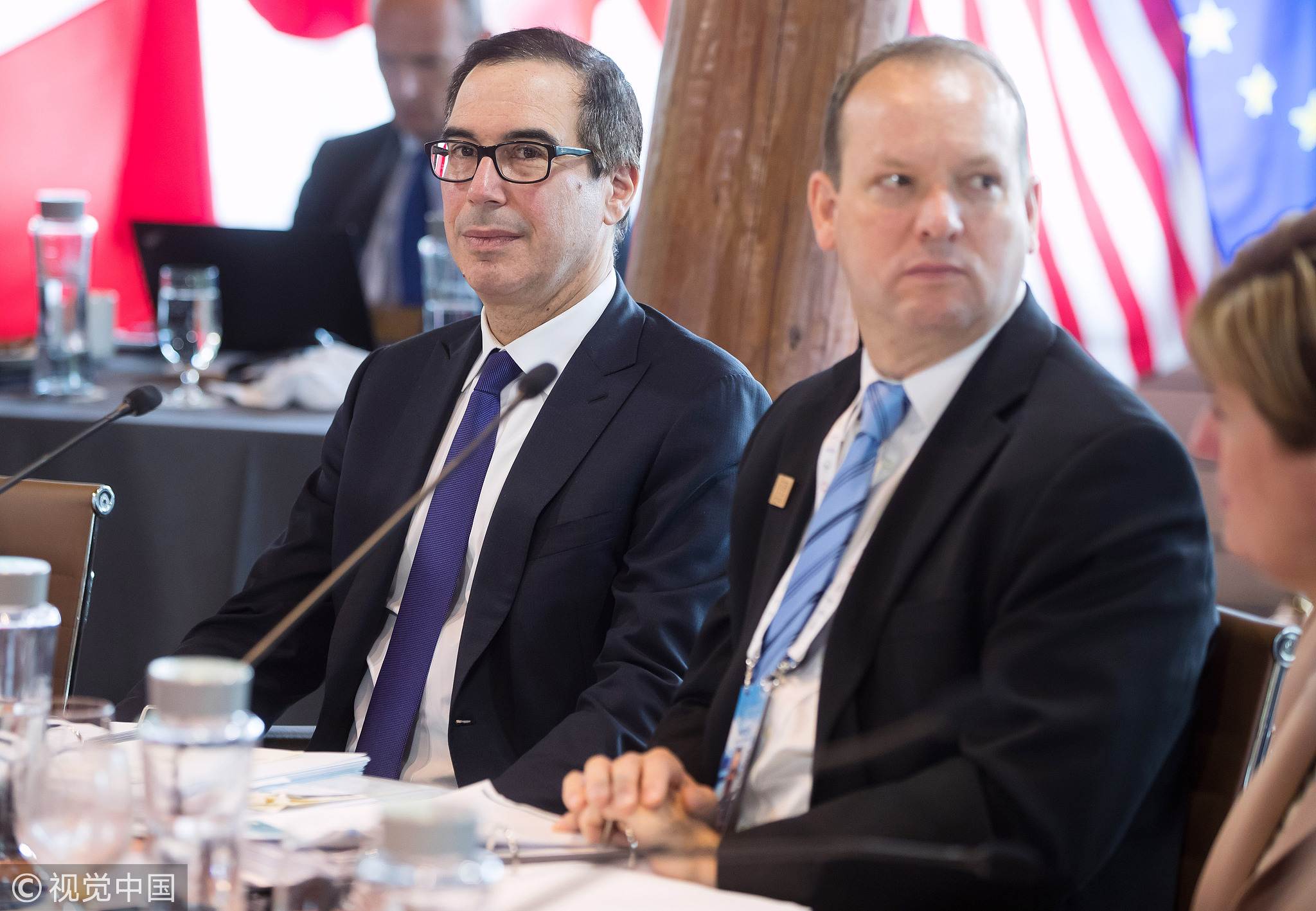Steven Mnuchin, US Treasury secretary, left, and David Moore, acting deputy administrator of USAID, listen during the G7 finance ministers and central bank governors meeting in Whistler, British Columbia, Canada, on Friday, June 1, 2018. [Photo: VCG]