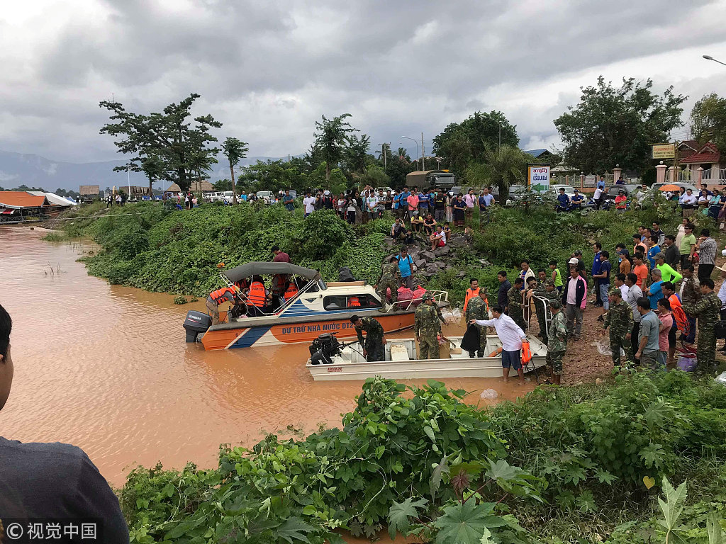 Rescuers work at a flooded site after a hydropower dam collapsed in Attapeu Province in Laos on Monday, seen here on Wednesday, July 25, 2018. [Photo: VCG]