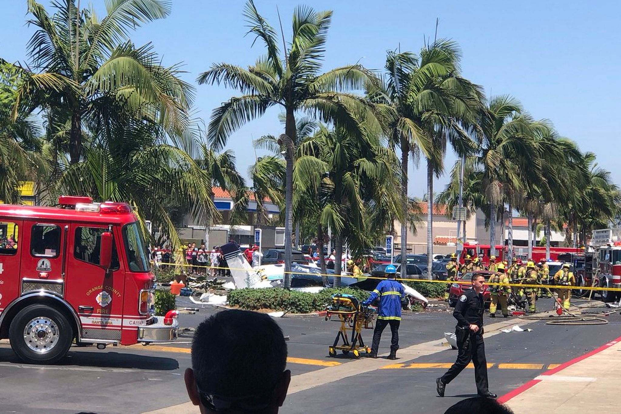 A twin-engine aircraft crashed near the South Coast Plaza shopping center in Santa Ana, Calif.,Aug. 5, 2018. [Photo: AP]