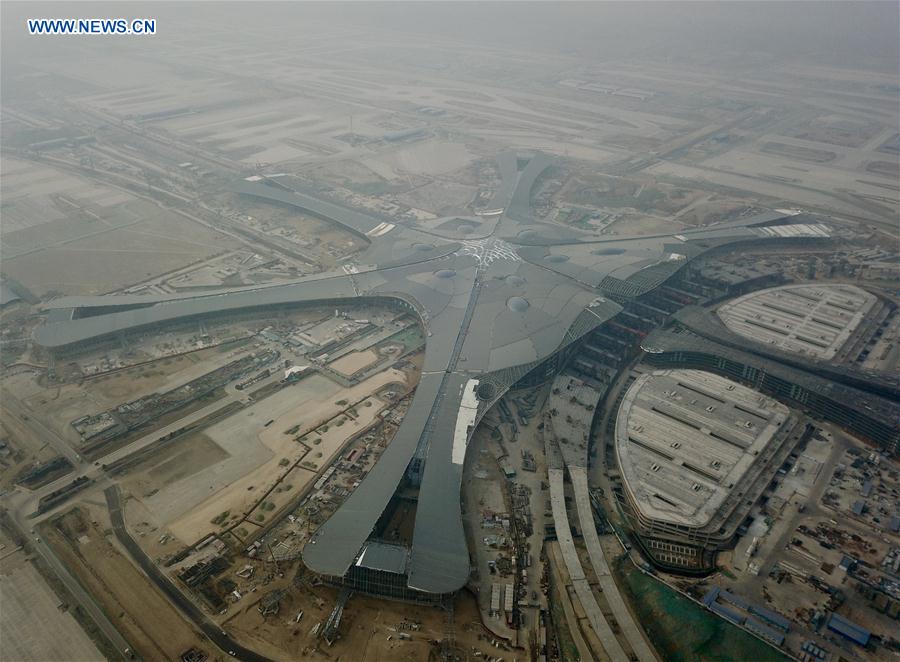 Aerial photo taken on Jan. 18, 2018 shows the construction site of Beijing's new airport in southern Daxing District in Beijing, capital of China. The new international airport is taking shape and roofed. The airport will take pressure off Beijing Capital International Airport in the northeastern suburbs and is expected to start trial operation in Oct. 2019. [Photo: Xinhua/Luo Xiaoguang]