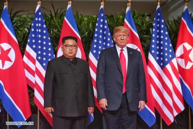 Top leader of the Democratic People's Republic of Korea (DPRK) Kim Jong Un (L) meets with U.S. President Donald Trump in Singapore, on June 12, 2018. [File photo: Xinhua]