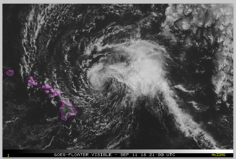 This satellite image made available the National Oceanic and Atmospheric Administration (NOAA) shows Tropical Storm Olivia east of the main islands of Hawaii at 11 a.m. Hawaii time Tuesday, Sept. 11, 2018. Central Pacific Hurricane Center meteorologist Matthew Foster says the storm could deposit 10 to 15 inches of rain on the islands, though some areas could get as much as 20 inches. [Photo: NOAA via AP]
