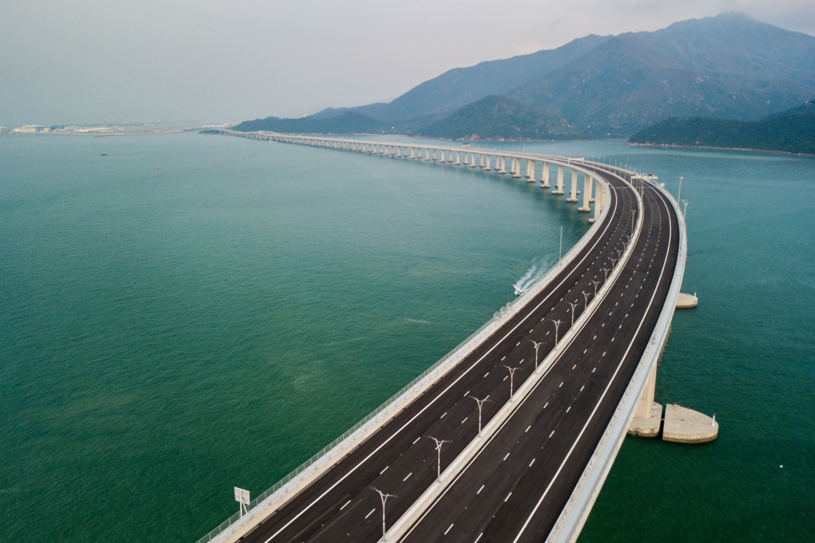 An aerial view taken on October 22, 2018, shows a section of the Hong Kong-Zhuhai-Macau Bridge (HKZM) in Hong Kong. The world's longest sea-bridge connecting Hong Kong, Macau and mainland China will be launched October 23, at a time when Beijing seeks to tighten its grip on its territories. [Photo: AFP/Anthony WALLACE]