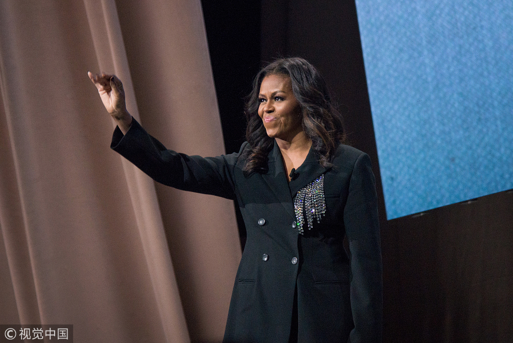 Former First Lady Michelle Obama appears onstage at Becoming: An Intimate Conversation with Michelle Obama at the Capital One Arena in Washington, Saturday, Nov. 17, 2018. She was joined by Valerie Jarrett, a former senior advisor to President Barack Obama. [Photo: Polaris/Erin Scott]