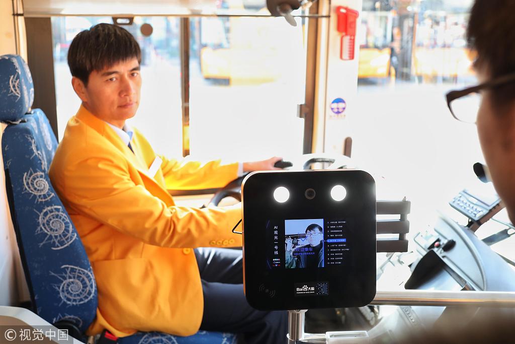 A tourist gets on the bus through facial recognition in Shanghai, December 18, 2018. [Photo: VCG]