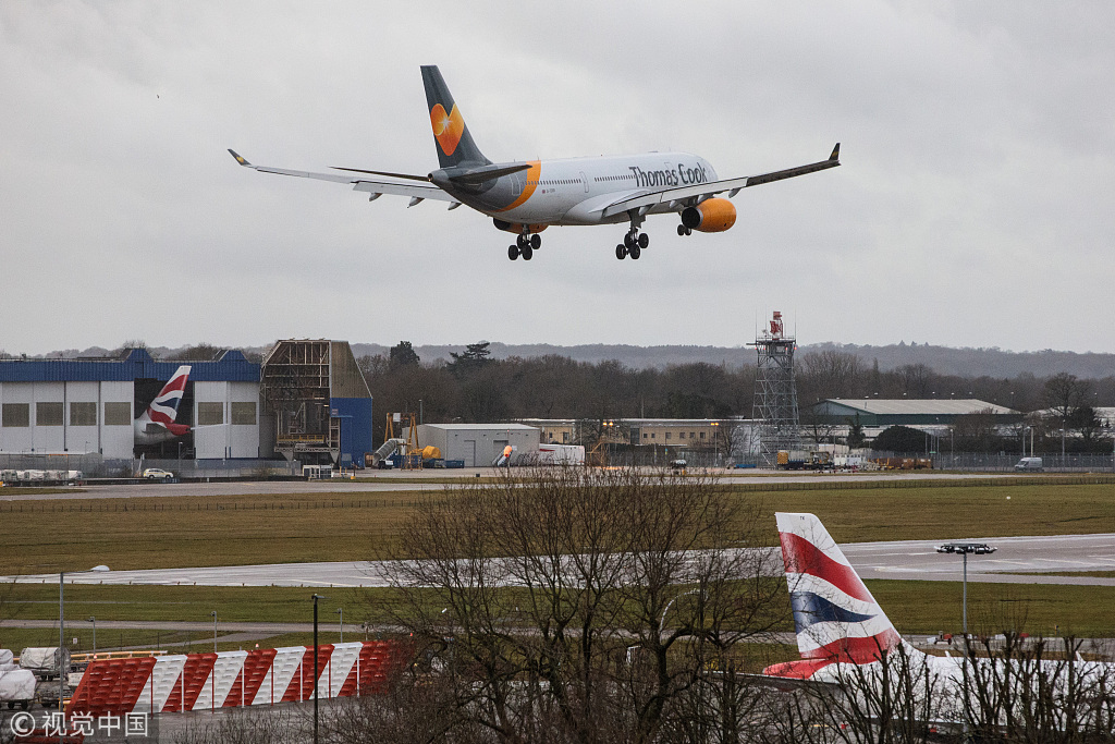 An aircraft comes in to land as the runway is reopened at Gatwick Airport on December 21, 2018 in London, England. Authorities at Gatwick have reopened the runway after drones were spotted over the airport on the night of December 19. The shutdown sparked a succession of delays and diversions in the run up to the Christmas getaway, in what authorities have called a 'deliberate act' to disrupt the airport. Police continue their search for the drone operators responsible. [Photo: VCG]