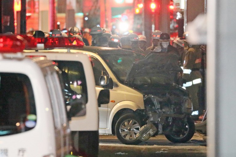 Police inspect a car whose driver rammed his vehicle into crowds on Takeshita street in Tokyo early January 1, 2019. [Photo: JIJI PRESS/AFP]