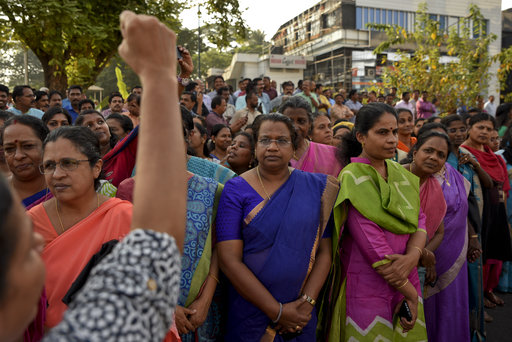A woman shouts slogans against gender discrimination as they gather to form part of a hundreds kilometer long "women's wall" in Thiruvananthapuram, in the southern Indian state of Kerala, Tuesday, Jan. 1, 2019. The wall was organized in the backdrop of conservative protestors blocking the entry of women of menstruating age at the Sabarimala temple, one of the world's largest Hindu pilgrimage sites defying a recent ruling from India's top court to let them enter. [Photo: AP]