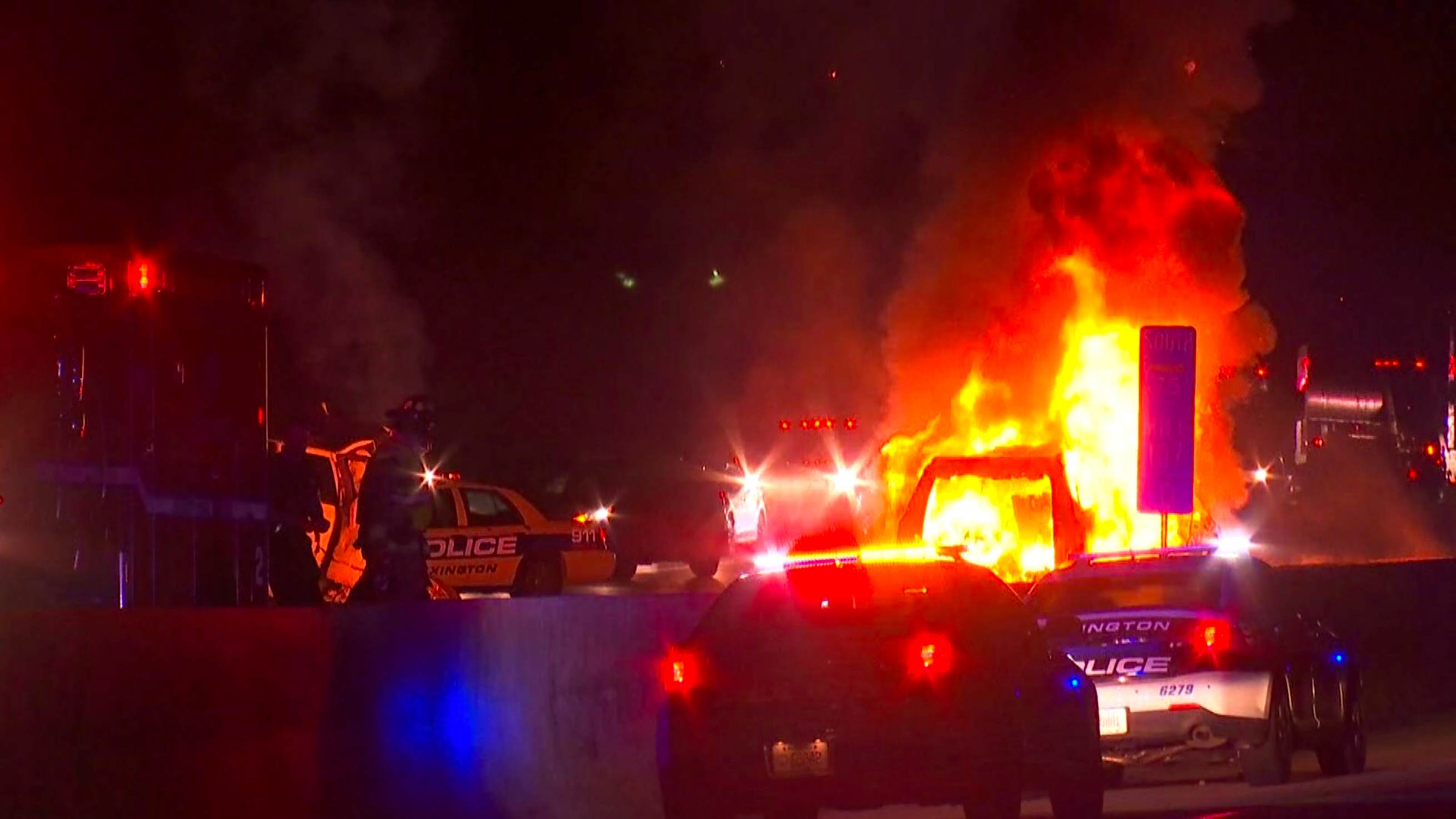 In this photo provided by LEX18, police officers and firefighters work at the scene of a deadly crash on Interstate 75 in Lexington, Ky., Sunday, Jan. 6, 2019. A suspected drunken driver heading the wrong way on a pickup truck struck a vehicle carrying several family members from Michigan early Sunday, killing all occupants of the vehicle, along with the pickup's driver, authorities said. [Photo: LEX18 via AP]