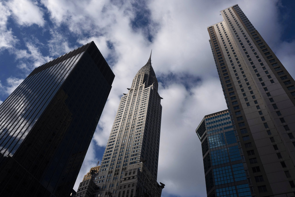 The Chrysler Building, center, stands next to other midtown skyscrapers, Wednesday, Jan. 9, 2019, in New York. The art deco masterpiece that was briefly the world's tallest skyscraper when it was completed in 1930 is up for sale. 