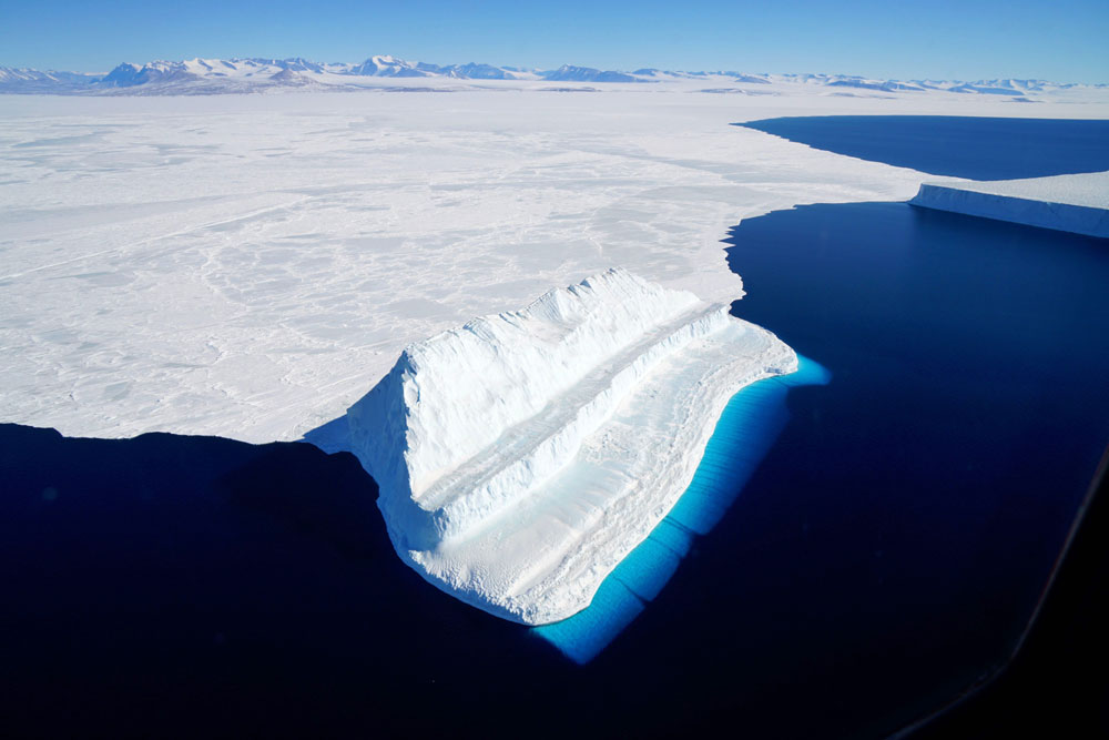 This file NASA image released on December 20, 2017 and acquired on November 29, 2017 by Operation IceBridge during a flight to Victoria Land, shows an iceberg floating in Antarctica's McMurdo Sound. [File photo: NASA/AFP/Chris Larsen]