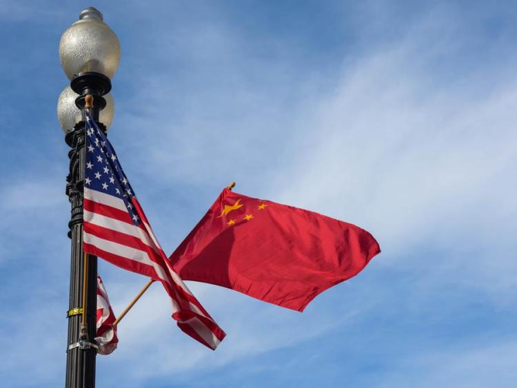 China urges US to work with China to implement consensus