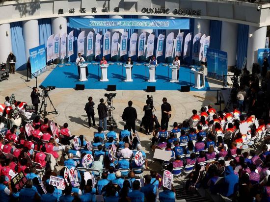 In the shadow of tragedy, Hong Kong holds its course