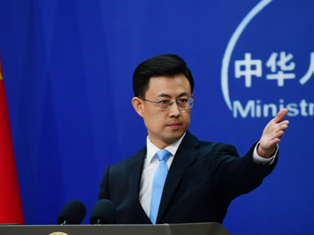 China urges Japan to fully sever ties with militarism