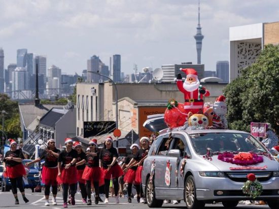 People attend parade to celebrate coming Christmas in Auckland, New Zealand