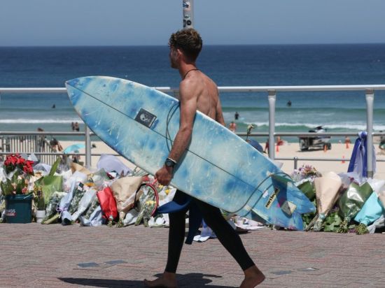 Australia announces gun buyback as swimmers mourn Bondi shooting victims