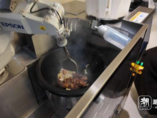 Hangzhou city opens AI robot eatery, drawing crowds with fully automated cooking