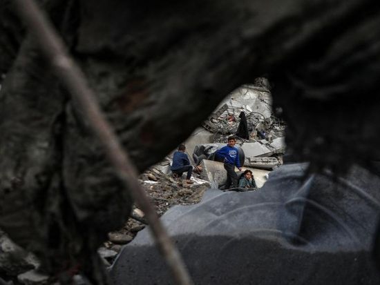 Palestinians inspect damage after Israeli airstrike in Gaza