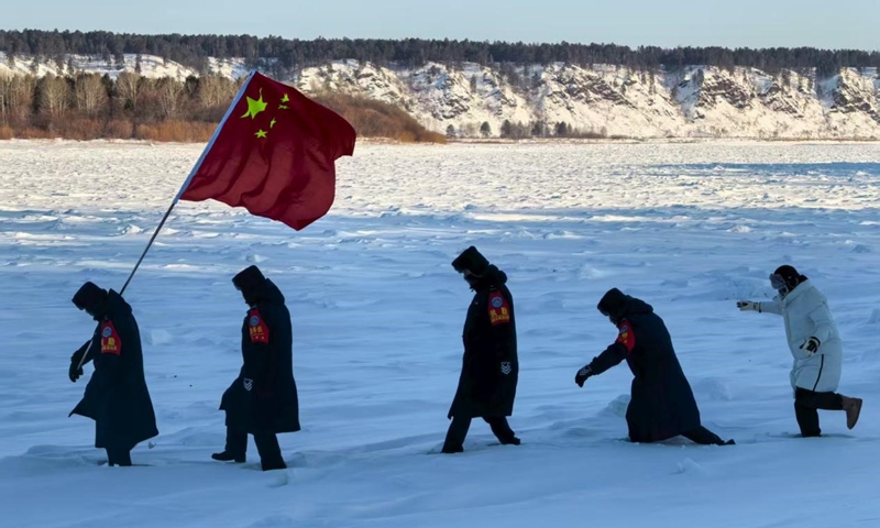 Police officers on a patrol in Luoguhe Village, Mohe, Heilongjiang Province. Photo: Zhang Tianpei 