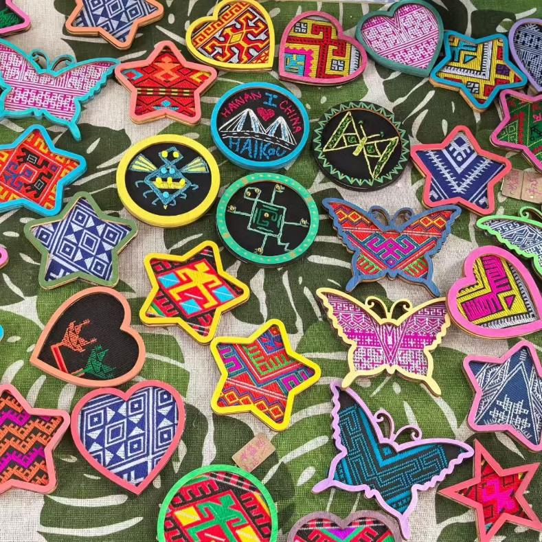 Various handicrafts with traditional elements from Li brocade made from coconut shells. Photo: Courtesy of Xie Min