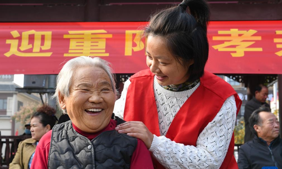 Volunteers offer shoulder massages to seniors in Shangqiu, central China's Henan Province, ahead of the Chongyang Festival, on October 27, 2025. Photo: Xinhua