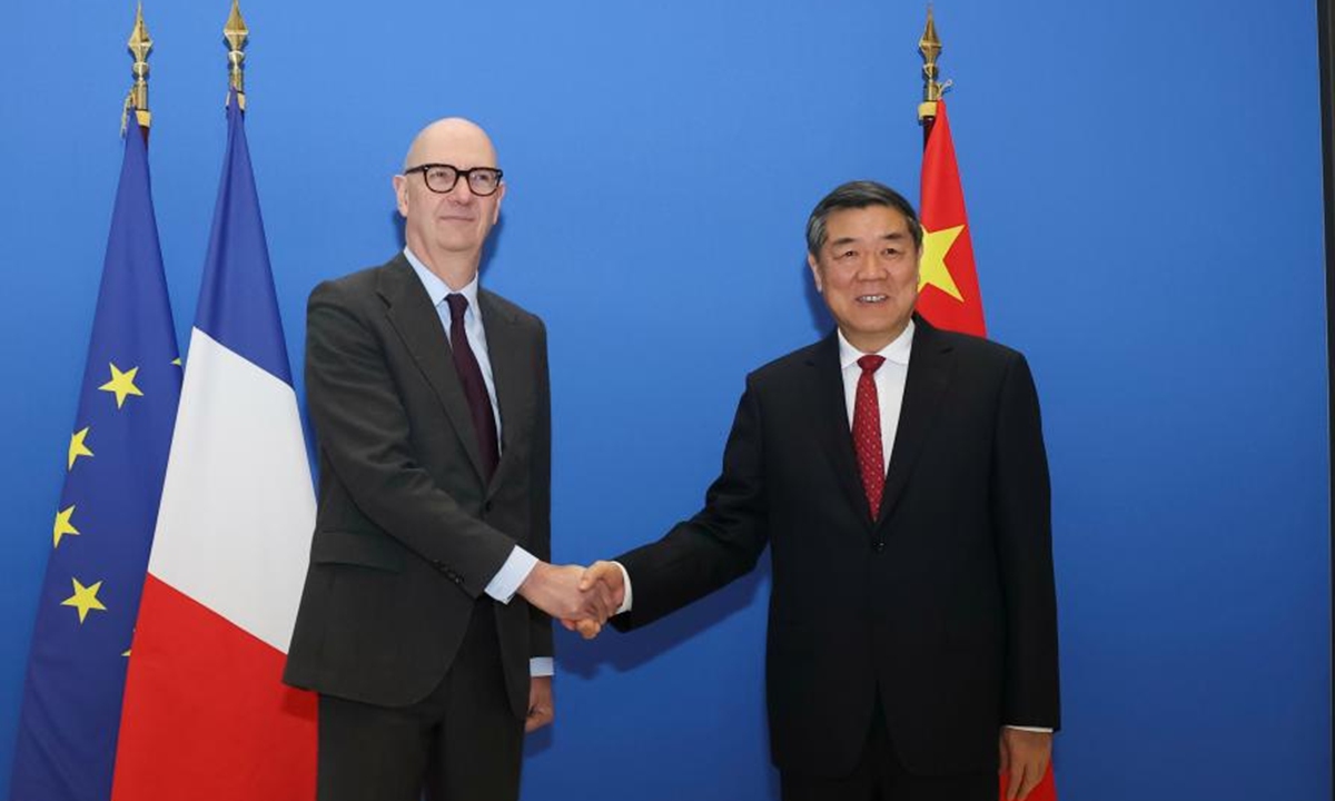 Chinese Vice Premier He Lifeng, the Chinese lead person of the China-France High-Level Economic and Financial Dialogue, shakes hands with French Finance Minister Roland Lescure, France's lead person of the dialogue, in Paris, France, on March 16, 2026. Photo: Xinhua