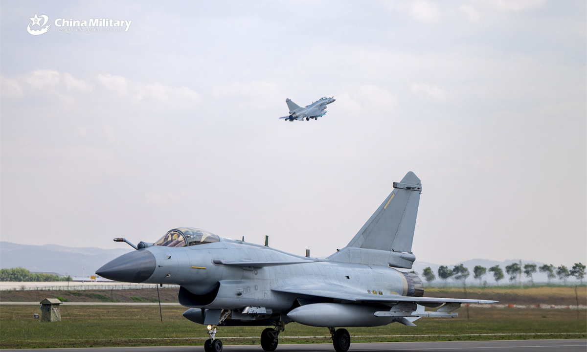 J-10 fighter jets attached to an aviation brigade of the air force under the Chinese PLA Southern Theater Command take off in succession during a day-and-night flight training exercise. (eng.chinamil.com.cn/Photo by Shang Jieyan)