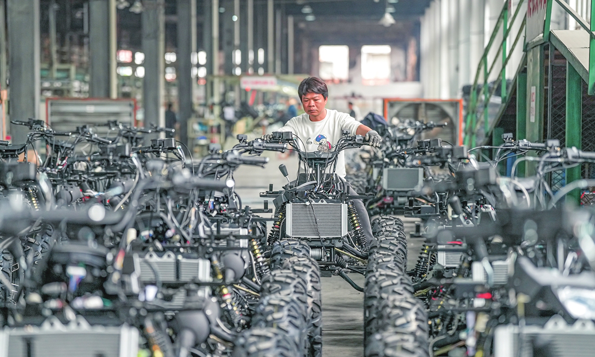 A worker assembles motorcycles on a production line at a manufacturing company in Jinhua, East China’s Zhejiang Province, on March 30, 2026. The company is ramping up production to fulfill orders and meet its annual targets. Photo: VCG