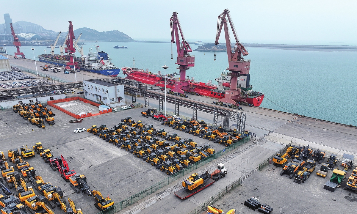 Cargo ships berth at Lianyungang Port in East China's Jiangsu Province, loading construction vehicles and machinery for export on March 15, 2026. Photo: VCG