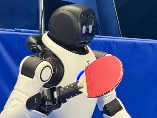 Chinese table tennis legend and US guests rally with humanoid robot
