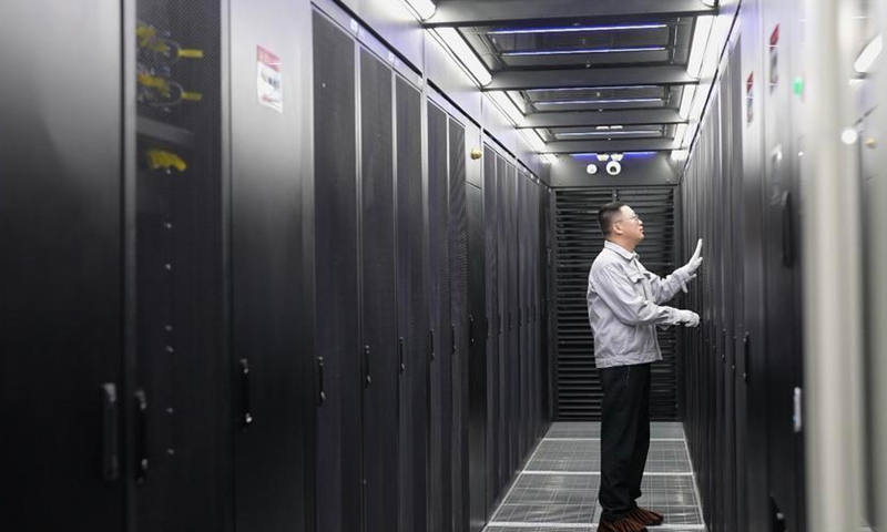 A staff member maintains equipment at the <span><span class=