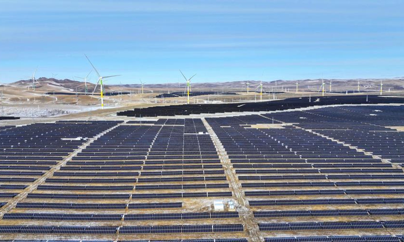 An aerial drone photo taken on Dec. 10, 2025 shows wind power and <span><span class=