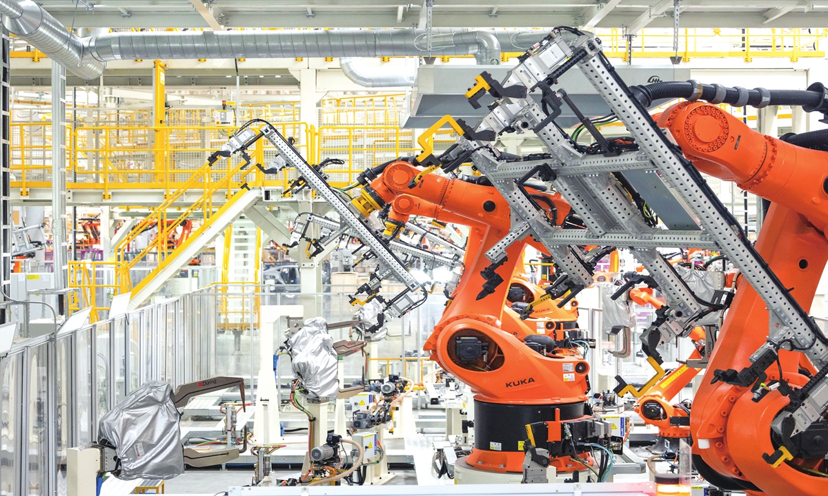 Industrial robot arms operate at the vehicle body workshop of Volkswagen's smart manufacturing base in Hefei, East China's Anhui Province. Photo: Courtesy of Volkswagen