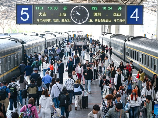 China's transportation network sees travel peak on first day of May Day holiday