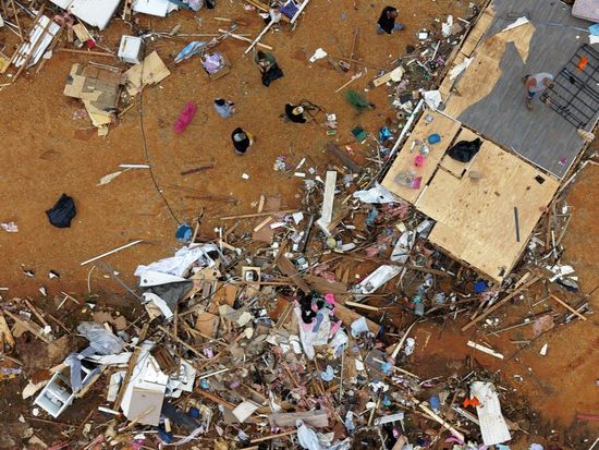 Survivors of Mississippi tornadoes crawled under furniture and held onto their kids