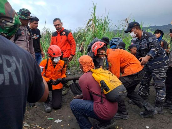 Indonesian rescuers find 1 body after volcano eruption as search continues for 2 more