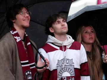 People watch live broadcast of IIHF World Ice Hockey Championship match in Latvia