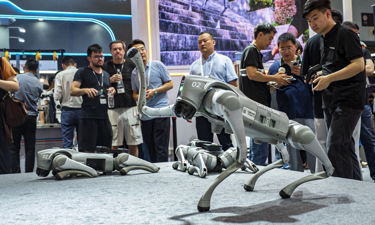 Quadruped robots developed by Unitree Technology draw crowds at the World Artificial Intelligence Conference in Shanghai. Photo: VCG