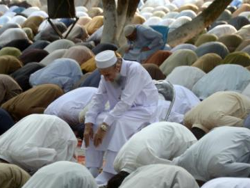 People offer Eid al-Adha prayers in Peshawar, Pakistan
