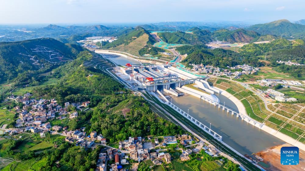 An aerial drone photo taken on June 3, 2026 shows water being pumped into the Madao hub on the Pinglu Canal in south China's Guangxi Zhuang Autonomous Region. Water began flowing through the final sections of the Pinglu Canal on Wednesday, bringing the long-awaited shortcut to the coast in south China a step closer to opening for navigation. As water was pumped into the canal on Wednesday morning, the 134.2-kilometer waterway has now achieved full-channel connectivity and entered the final phase ahead of its expected inauguration in September. (Photo: Xinhua)