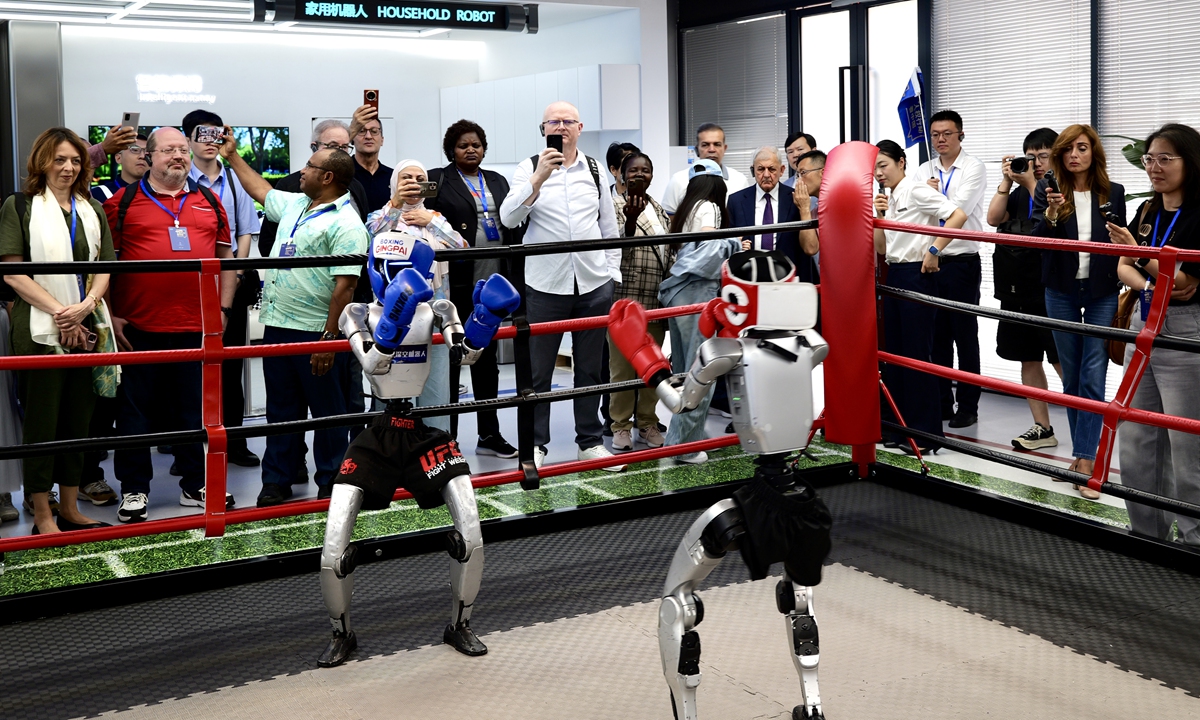 Chinese and international guests watch a humanoid robot boxing match and experience technological innovations during a visit to the Wensan Digital Life Block in Hangzhou, East China's Zhejiang Province on June 7, 2026. Photo: VCG